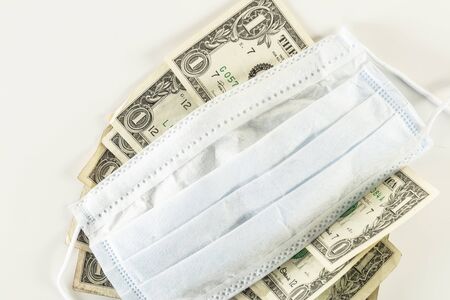 protective mask on one dollar bill, concept of currency protectionの写真素材