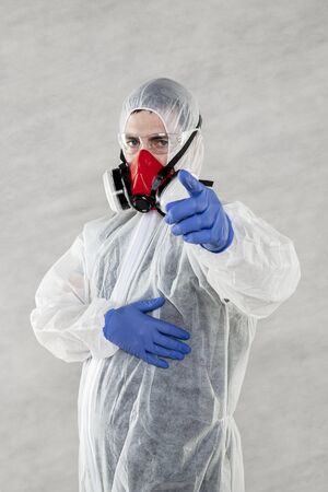 portrait of a virologist in a protective suitの写真素材