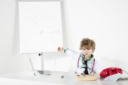 young doctor points to chemical bond boardsの写真素材
