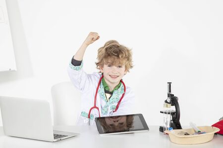 young doctor uses tablet, an innovation in online medicineの写真素材