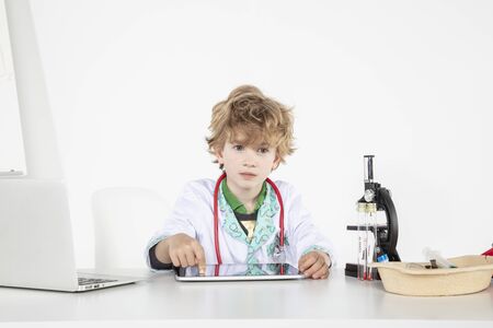 young doctor uses tablet, an innovation in online medicineの写真素材