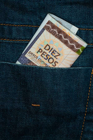 cuba currency in denim pants, people exploitation conceptの写真素材
