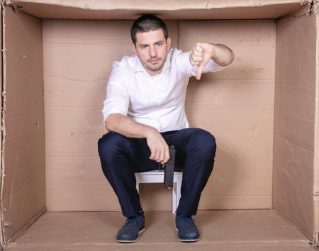 businessman overcrowded depression thoughts of suicide, gun in handの写真素材