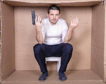 businessman overcrowded depression thoughts of suicide, gun in handの写真素材