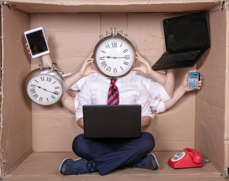 happy multitasking businessman ready for new challenges at work, clock instead of headの写真素材