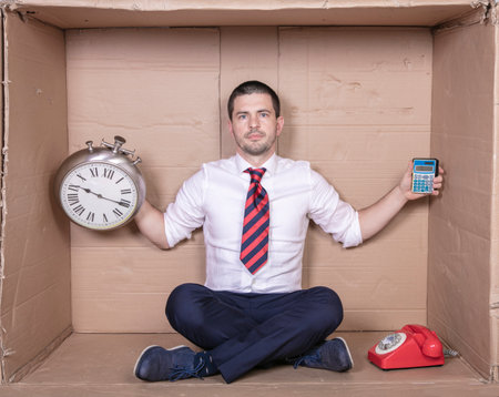 businessman counts his precious timeの写真素材