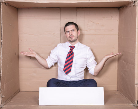 businessman spreads his hands to the sides, copy space on the boardの写真素材