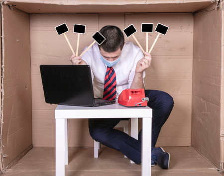 burned out businessman holds clean squares in his hands, copy spaceの写真素材