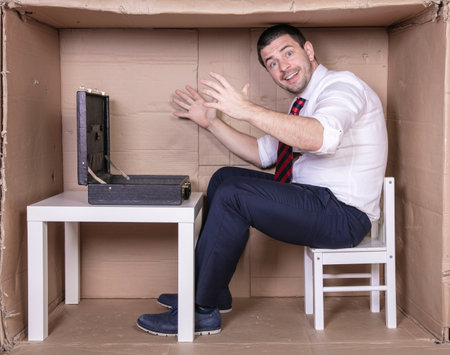 dissatisfied businessman shows at empty briefcaseの写真素材