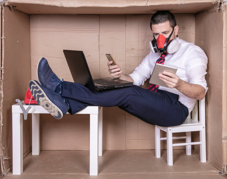 businessman working on several mobile devices at the same timeの写真素材