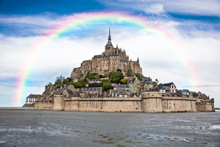 View of the beautiful cathedral Le Mont Saint-Michel in Normandy, France, rainbow over the cathedralの写真素材