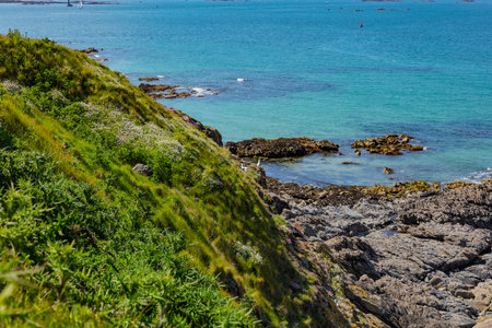 beautiful view from the island towards the sea, small islets and a green slope, Saint Malo, Franceの写真素材