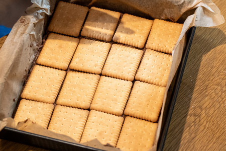 biscuits in a box on a wooden table, top viewの写真素材