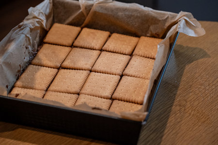 Biscuits in a box on a wooden table, close-upの写真素材