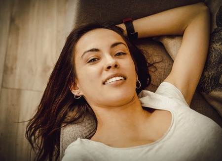 Relaxing on sofa.の写真素材