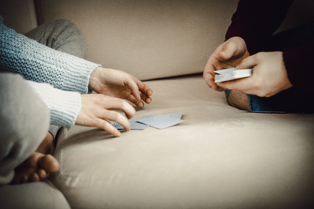 Couple playing with cards.