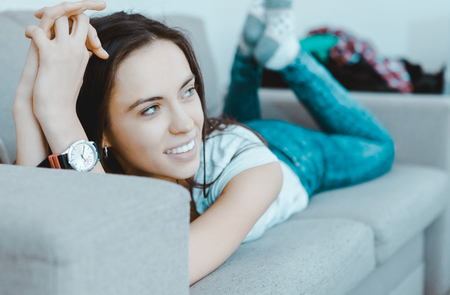 Relaxing on sofa.の写真素材
