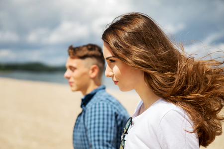 Teenage couple at seasideの写真素材