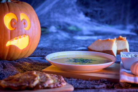 Scared pumpkin wattering from pumpkin - halloweenの写真素材