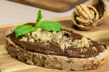 Homemade chocolate cream with avocado, banana, cocoa and raspberriesの写真素材