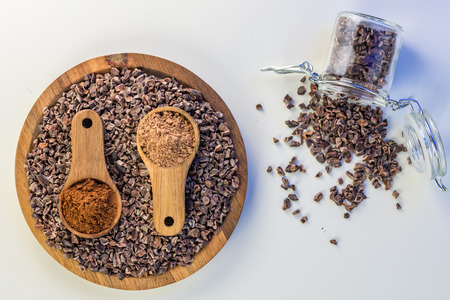 Cocoa beans and cacao powder - closeup with detail macro shot.の写真素材