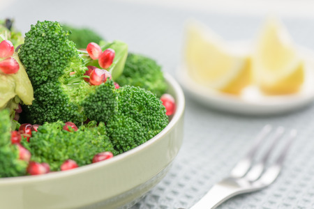 Broccoli salad with pomegranate and guacamole - Healthy mealの写真素材