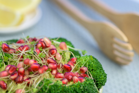 Broccoli salad with pomegranate and avocado sauce - Healthy food.の写真素材