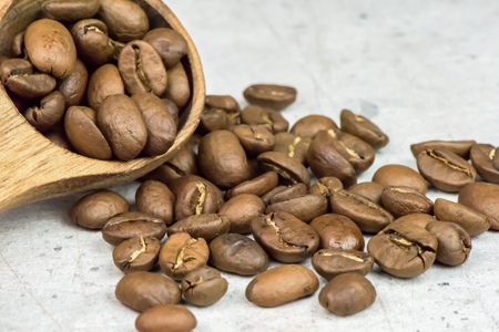 Roasted coffee beans - seeds - on light background - macroの写真素材