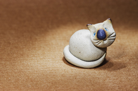 Ceramic figurine cute white catの写真素材