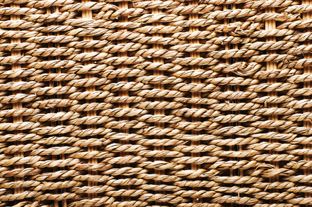 Woven basket texture. Textured basket made of natural fiber as a background.