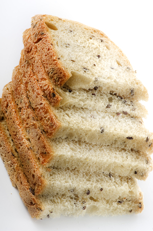 Sliced homemade bread isolated on white background.