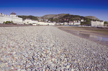 Llandudno promenade with a stony beach North Wales Coast ,Ukの写真素材