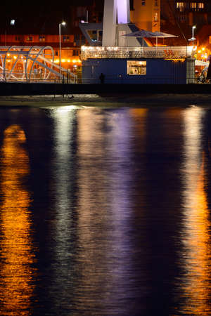 Drawbridge in harbor in Ustka at night, Poland, Baltic sea.の写真素材