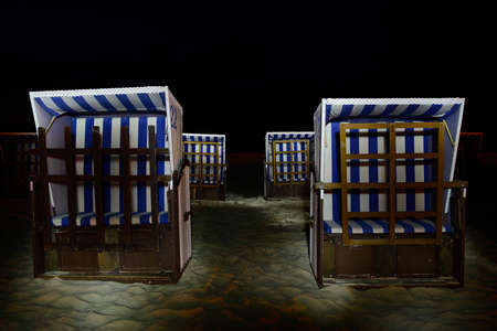 Wicker armchair on the beach, light painting Ustka, Poland, Baltic seaの写真素材