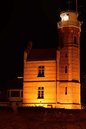 Lighthouse in Ustka at night, Poland, Baltic sea.の写真素材