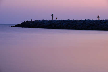 Sunrise in port in Ustka, Poland, Baltic sea.の写真素材