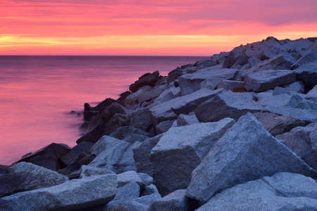 An embankment at polish coast of Baltic sea at sunset, Ustka, Poland, Baltic sea.の写真素材