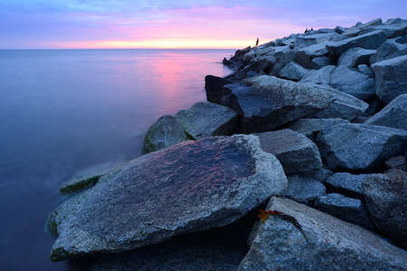 Embankment at polish coast of Baltic sea at sunset, Ustka, Poland, Baltic sea.の写真素材