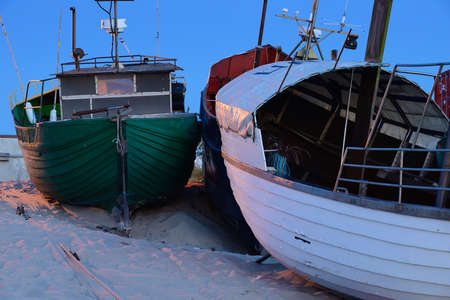 Fishing boats on the beach at night, Uniescie, Poland, Baltic sea.の写真素材