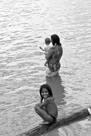 Girl and her mother, on the banks of the San Francisco river. Brazilのeditorial素材