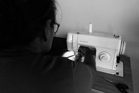 a woman sewingの写真素材