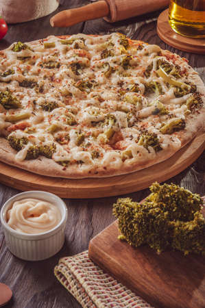 Brazilian pizza with mozzarella, broccoli, catupiry and parmesan (Broccoli pizza)の写真素材