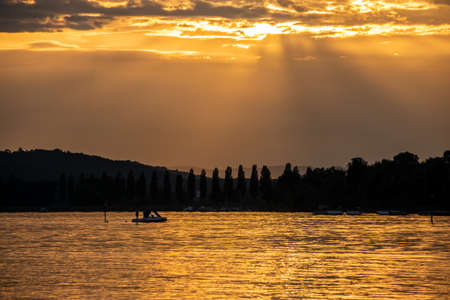 Pedal boat on Lake Constance at the golden hourの写真素材