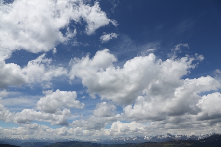 Alpine peak with blue sky and cloudsの写真素材