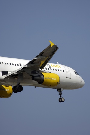 Barcelona, Spain - March 16,  2007 : Airbus 320 of Vueling spanish airline, approaching to Barcelona Airportのeditorial素材