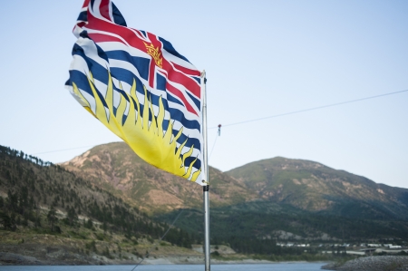 provincial flag of British Columbia in the wind on ferryの写真素材
