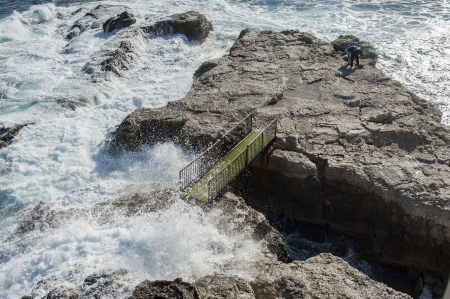 Italy. rocks and waves. Off the coast of syracuse