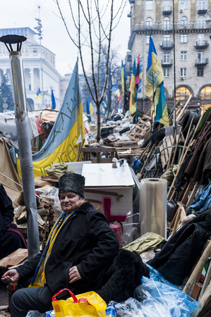 Ukraine / Kiev, 21st dec 2013: Cossack - activist. For three months protestors camped on Kiev main square Maidan Nezalezhnosti in peaceful manner, doing demonstrations, preparing food and tea, holding discussions and just waiting for the regime to pass - のeditorial素材