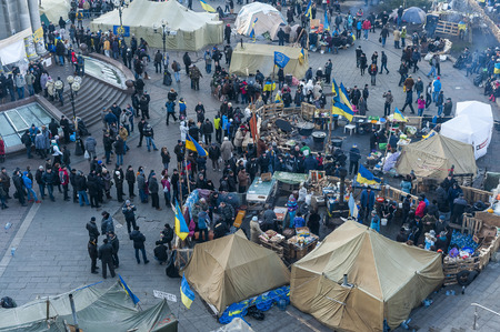 Ukraine / Kiev, 23rd dec 2013: For three months protestors camped on Kiev main square Maidan Nezalezhnosti in peaceful manner, doing demonstrations, preparing food and tea, holding discussions and just waiting for the regime to pass - mass demonstration oのeditorial素材