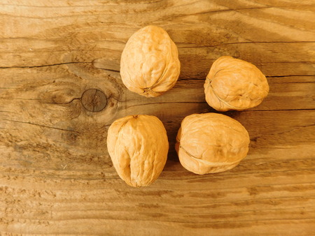 nuts on wooden base